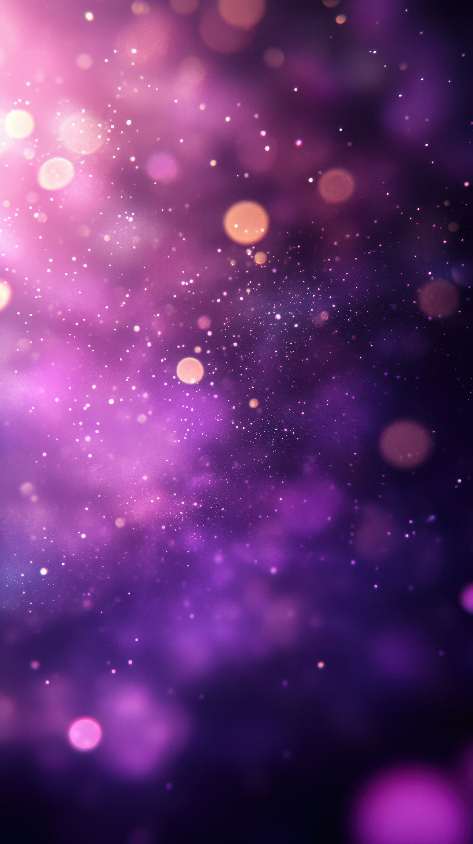 Colorful bokeh lights and sparkling particles create a dreamy atmosphere in a purple background